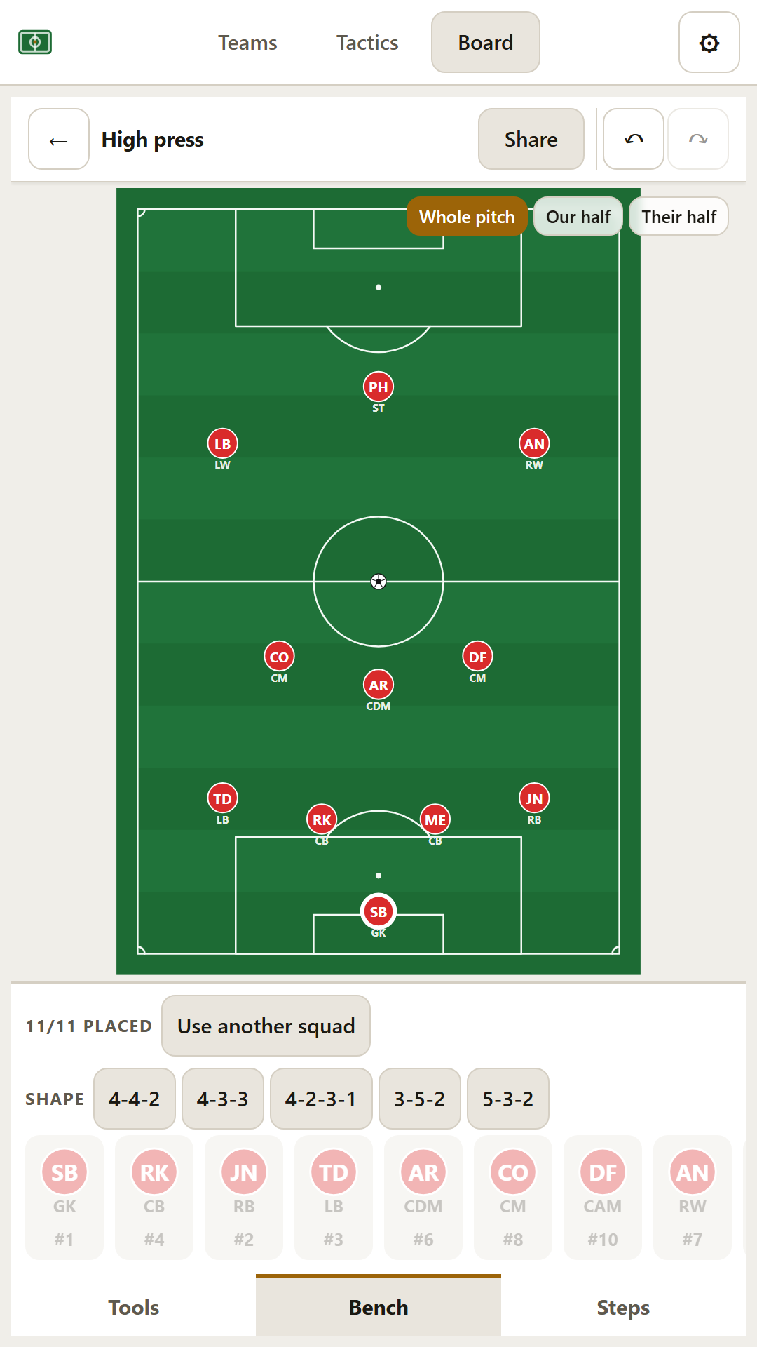 The tactics board on a phone, showing a 4-4-2 formation laid out on a green pitch with numbered player circles.